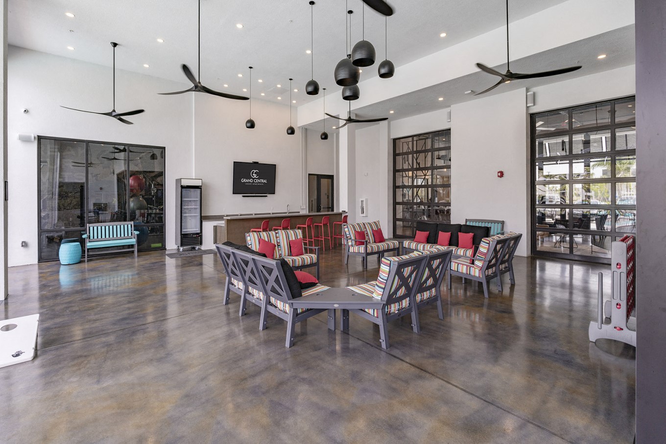 a large living room with a large table and chairs
